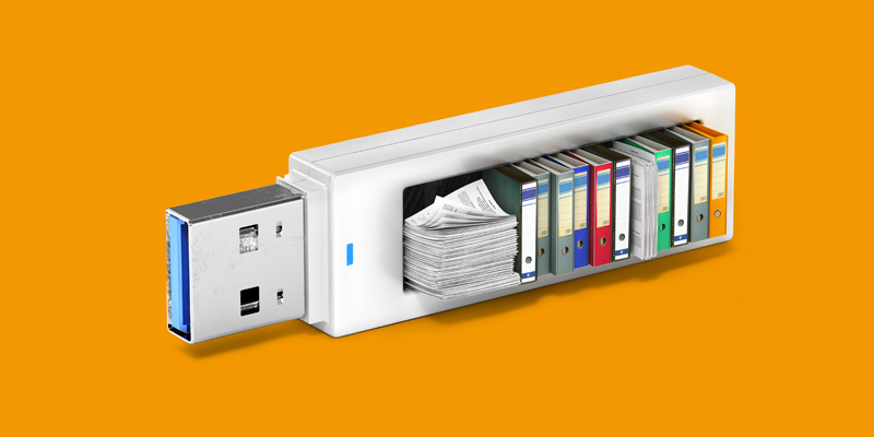 Una memoria USB llena de libros, archivos y carpetas